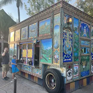 people standing in front of it