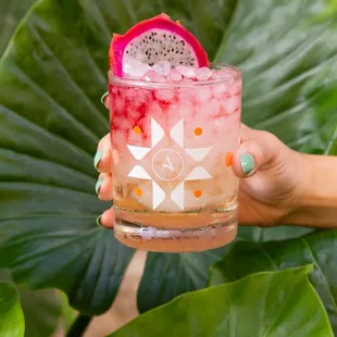 a person holding a drink