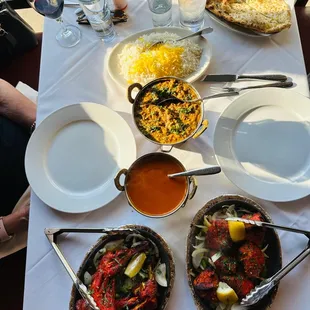 a table with a variety of dishes of food