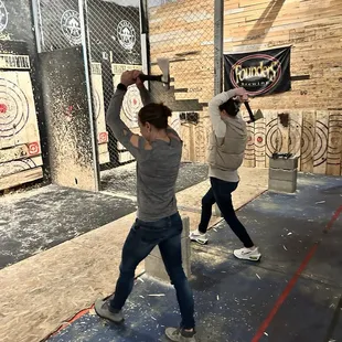 Throwing bay with lines for distance and people throwing.