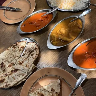 Chicken Tikka masala and chicken vindoloo and garlic naan bread