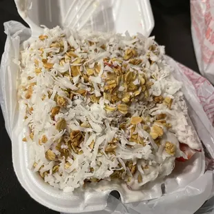 Small bionicos w/mango &amp; strawberry. Toppings: coconut and granola