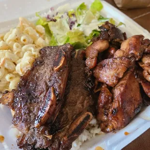 a plate of meat and macaroni salad