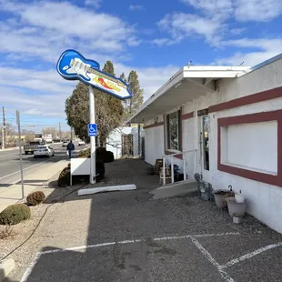 A guitar pointing at the front door