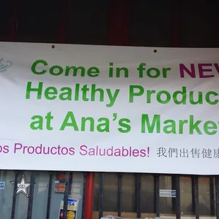 a sign that says come in for new healthy products at ana's market