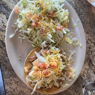 Guacamole tostada and a beef and bean tostada