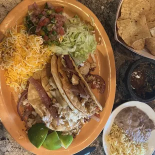 Three fish tacos in crunchy corn taco shells