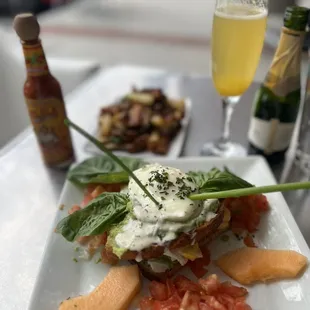 Eggs Laguna, side of potatoes and a mimosa