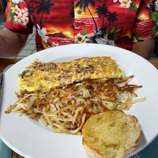 Western omelette with crispy Hash Browns and an English Muffin. We ordered a side of bacon and it was the best we've ever tasted!
