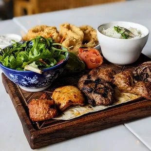 Mixed grill meat entree and calamari appetizer.
