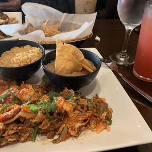 Shredded beef machaca with rice and beans, agua de sandia (watermelon water).