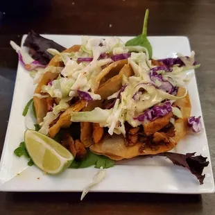 2 crispy tacos, no beans and rice on the side as the menu states.