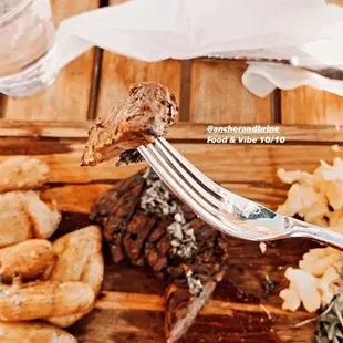 a plate of food on a wooden table