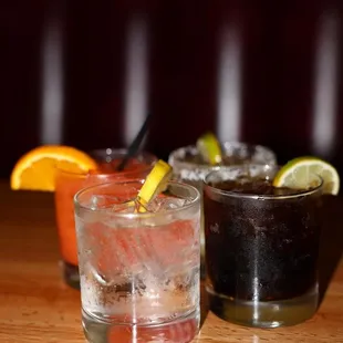 three different cocktails on a table