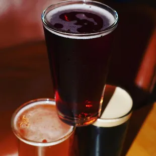 two glasses of beer on a table