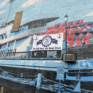 Outside mural on side of building.