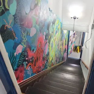 Staircase to the upstairs seating - LOVELY painted art