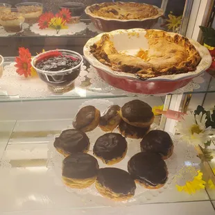 Dessert case with burnt pie.