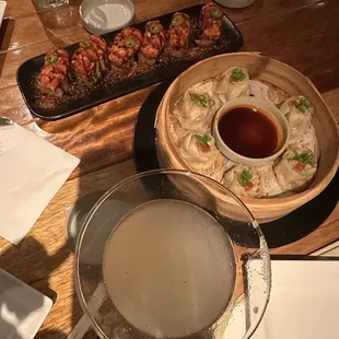 a plate of dumplings and a bowl of soup