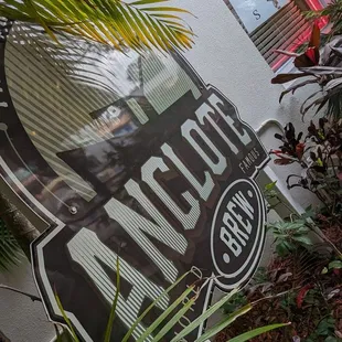 a sign in front of a building