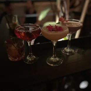  three cocktails on a bar top