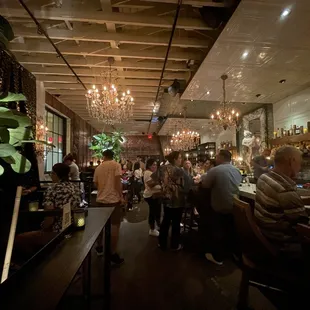  people sitting at tables in a restaurant