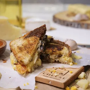 a grilled cheese sandwich on a cutting board