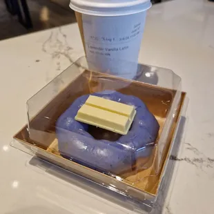 a doughnut and a cup of coffee