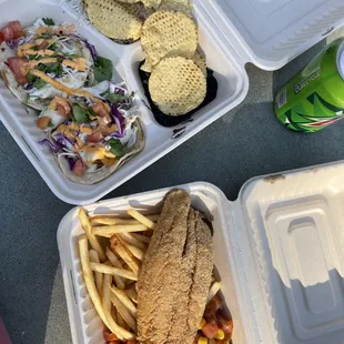 Mahi Mahi fish tacos and fried sea bass with fries and avocado salsa