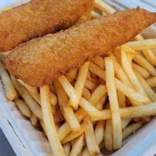 two fish sticks and fries in a styrofoam container