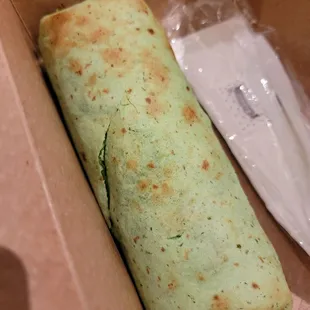 Breakfast burrito in a spinach wrap
