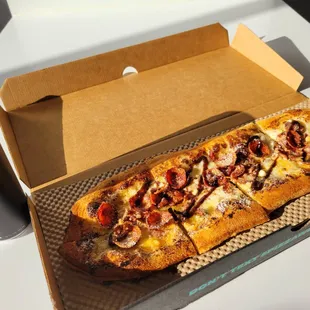 a box of pizza and a can of soda
