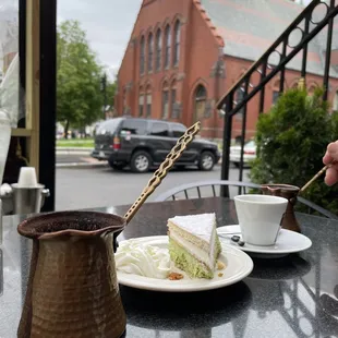 Arabic and Turkish coffees with pistachio cake.