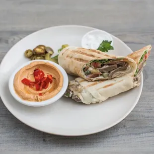 Gyro sandwich and a side of Spicy Hummus