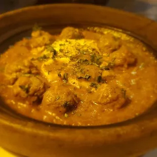 Kefta Tagine (Moroccan beef meatballs) served in traditional Moroccan earthenware