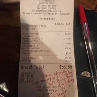 a receipt and a pen