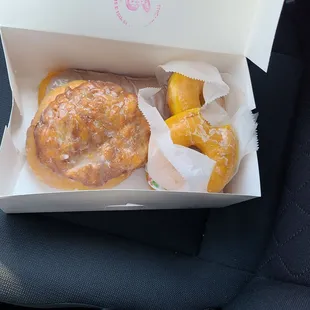 Apple fritter on left. Fresh hot glaze on right