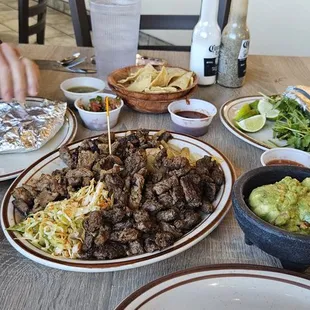 Taco Platter for two. Lots of meat.  Two bowls of flavorful beans.  Plenty of guacamole.
