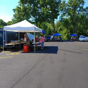  woman standing under a tent