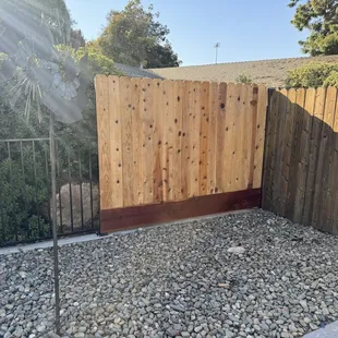 Wrought iron fencing with wood section