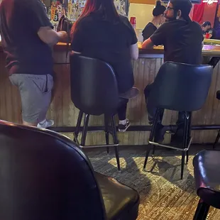 people sitting at the bar