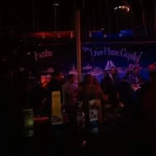a crowd of people at a bar