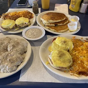 Eggs Benedict with Hash-browns, full order or biscuits and gravy with extra gravy and three blueberry pancakes.