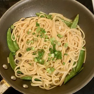 Buttered Tabasco noodles with sugar snap peas and scallions