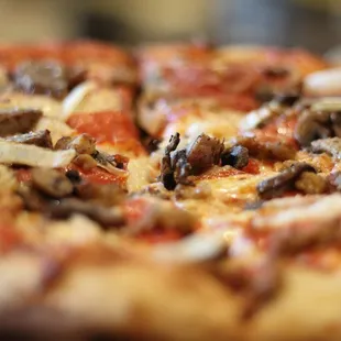 a pizza with mushrooms and cheese