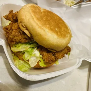 ows a sandwich in a styrofoam container