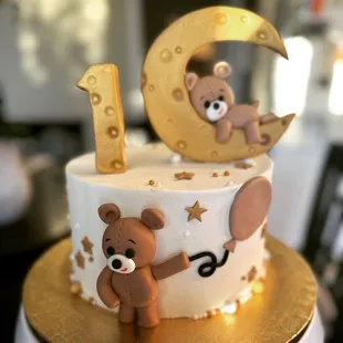 a cake with a teddy bear on it