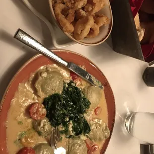 a bowl of soup and a plate of fried shrimp