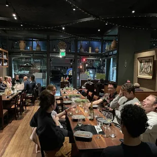 a group of people sitting at a table
