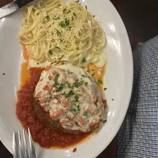 Chicken Parmigiana with white pasta.